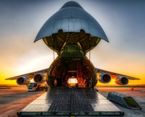 Plane on the ground with wide open freight room stock photo